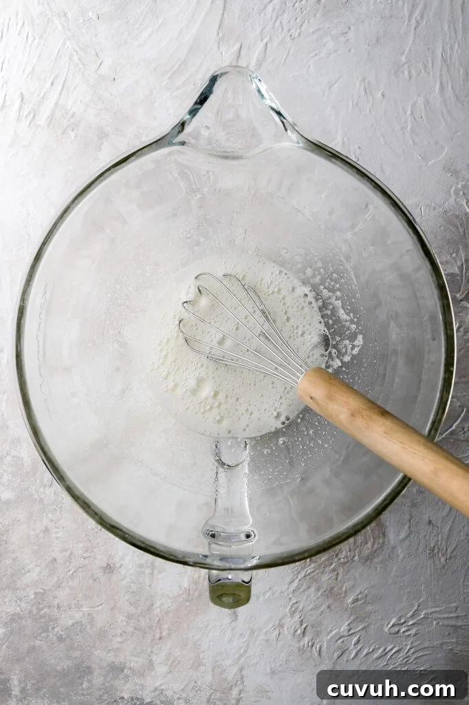 Party-Size Vanilla Birthday Sheet Cake Recipe 13 cooked egg whites and sugar looking frothy