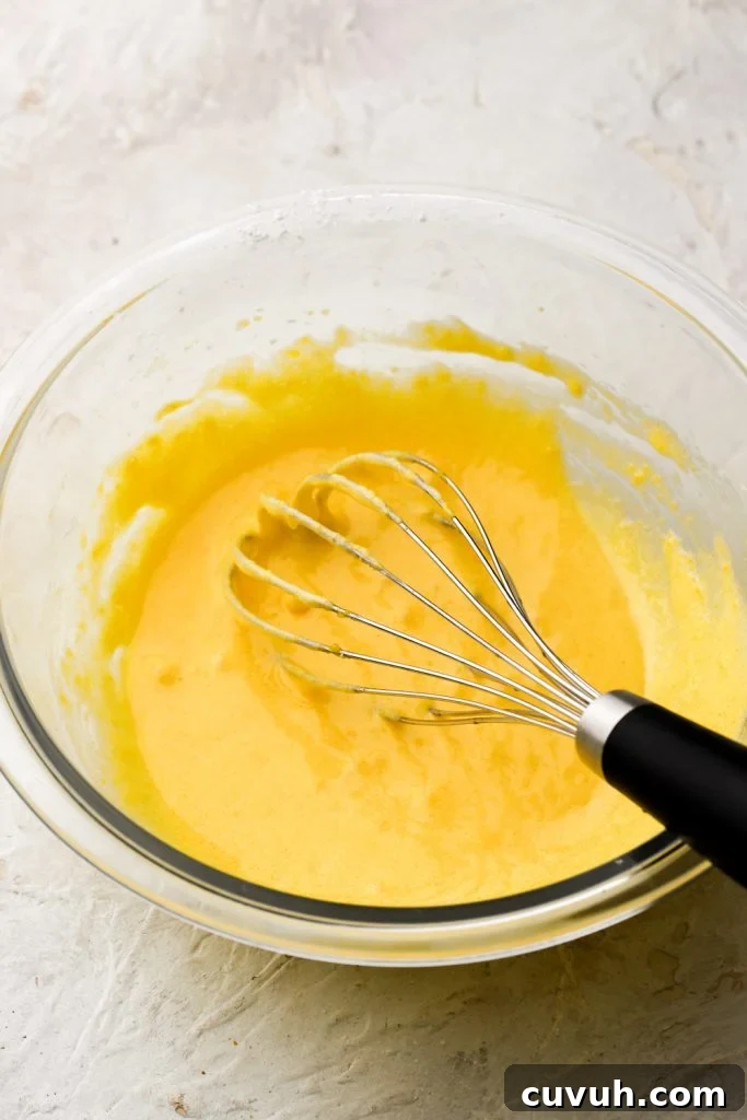 Party-Size Vanilla Birthday Sheet Cake Recipe 17 egg yolks whisked with sugar and cornstarch - smooth
