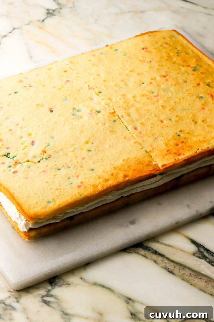 Party-Size Vanilla Birthday Sheet Cake Recipe 25 top layer of cake placed on top of the custard and frosting