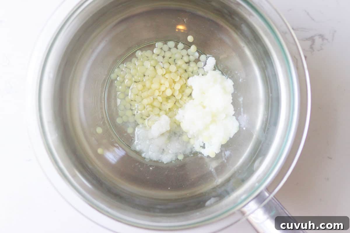 a saucepan with beeswax, shea butter and coconut oil in it