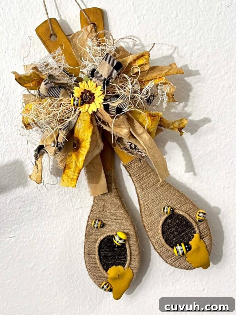 21 Chic DIY Summer Crafts to Refresh Your Home Decor 21 19. Dollar Tree Wood Spoon Beehives