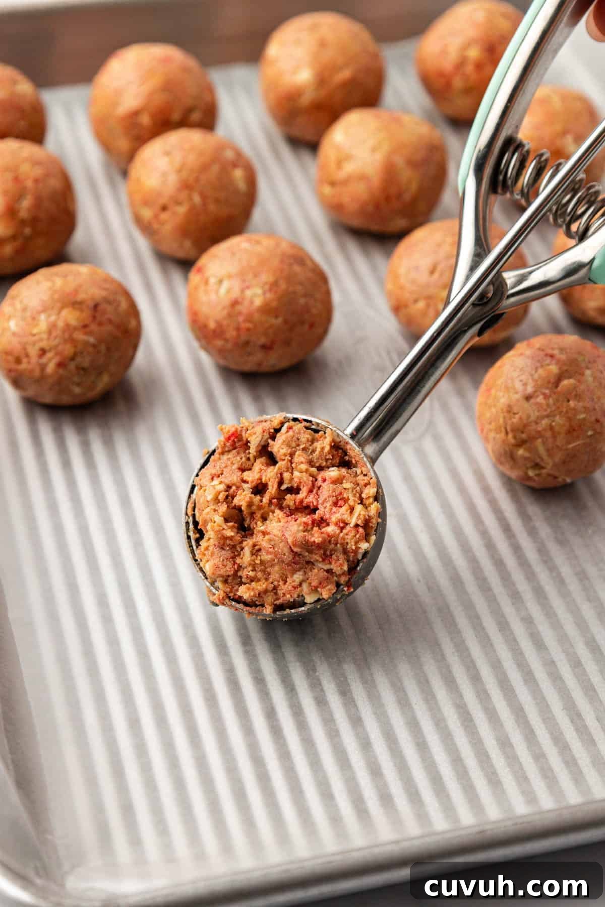 mini cookie scoop with energy bite batter in it