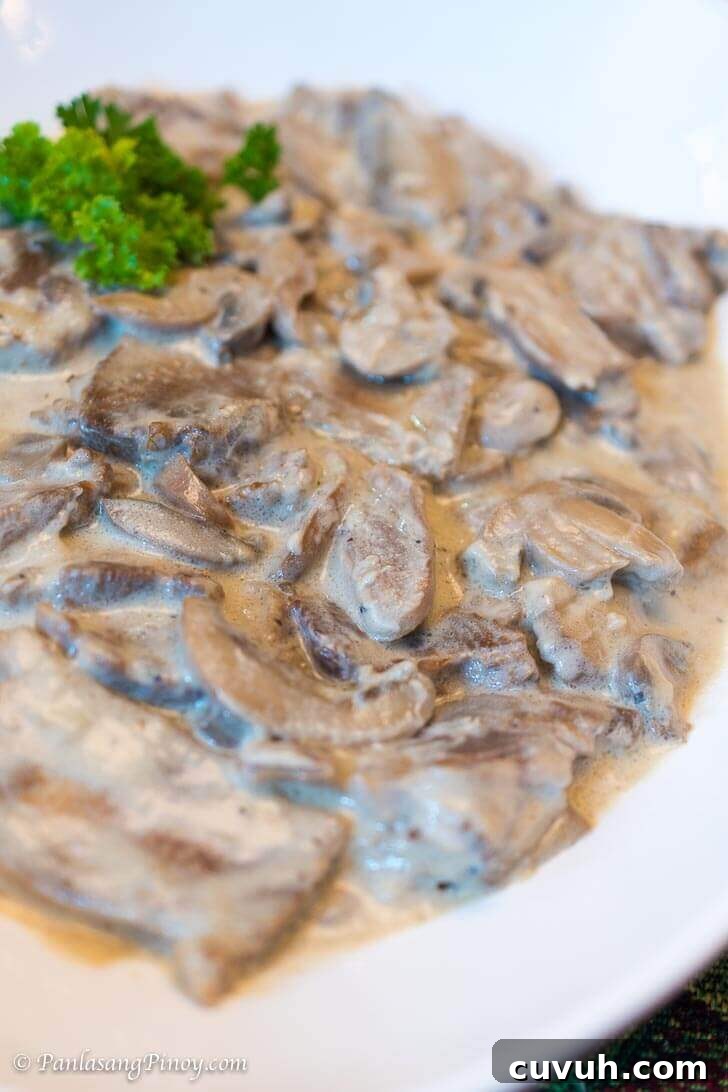 Lengua in White Mushroom Sauce