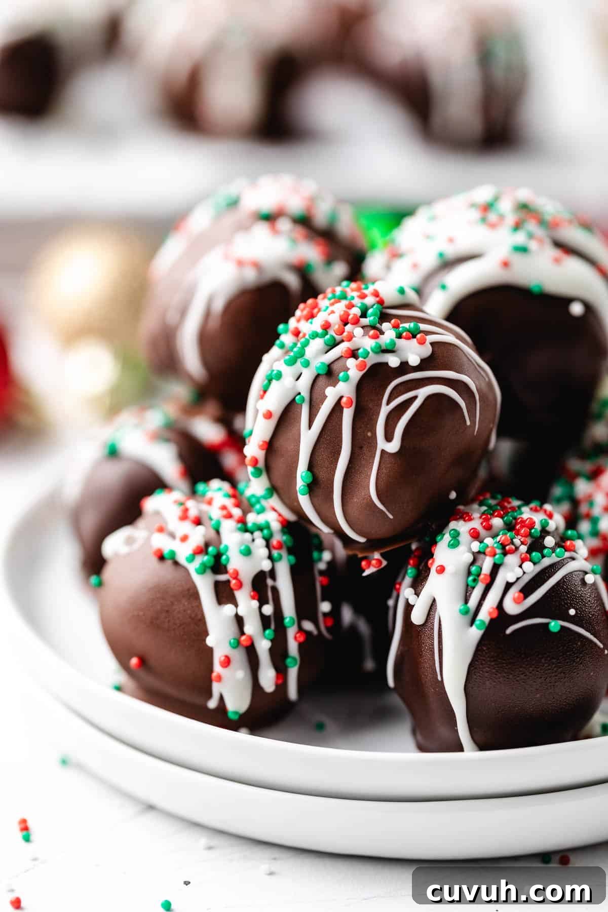 Red, green, and white sprinkles over brownie candies.