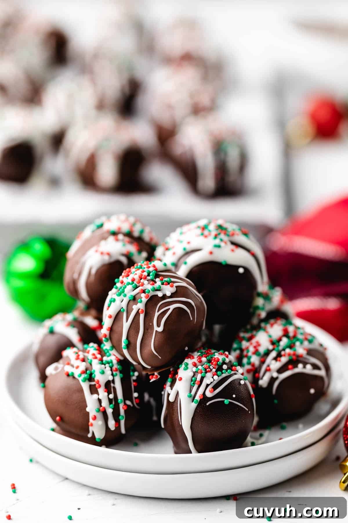 White chocolate and Christmas sprinkles on top of chocolate truffles.
