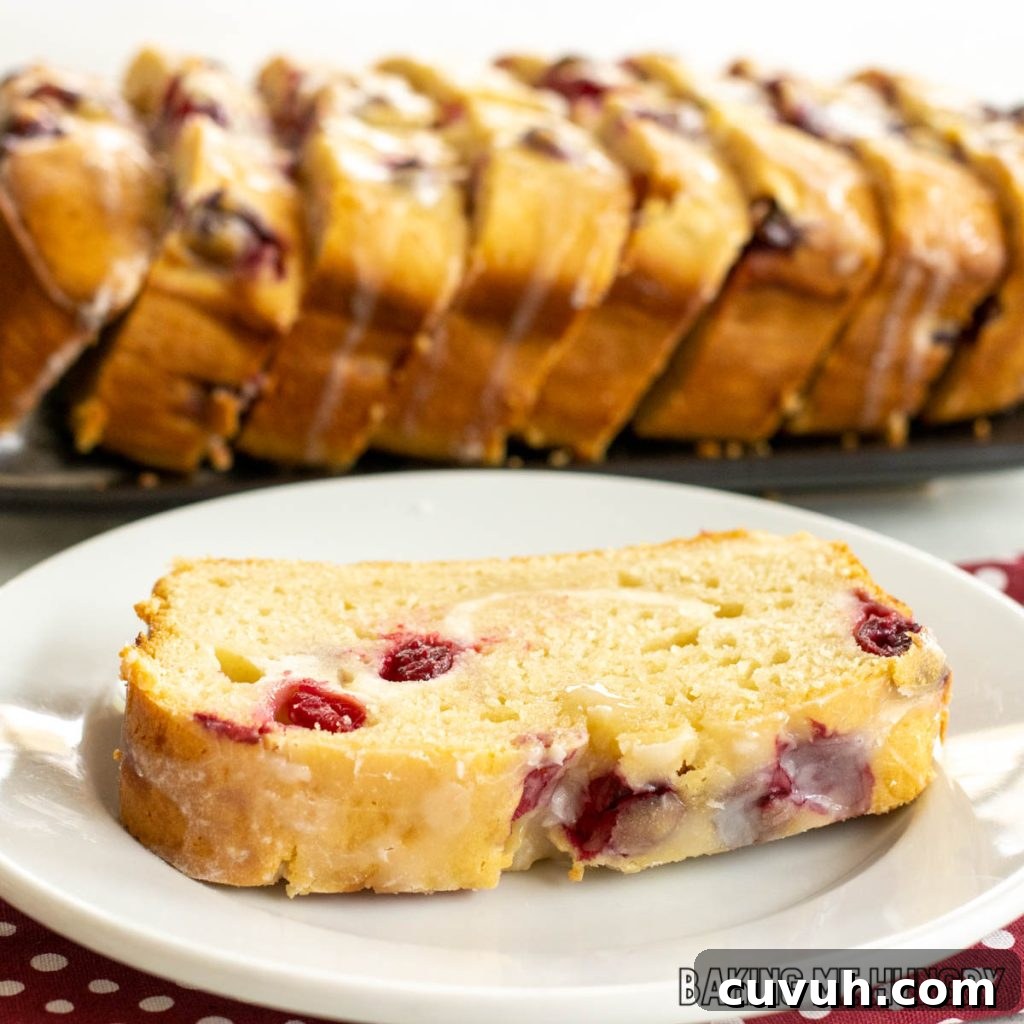 plate with piece of cranberry cream cheese bread