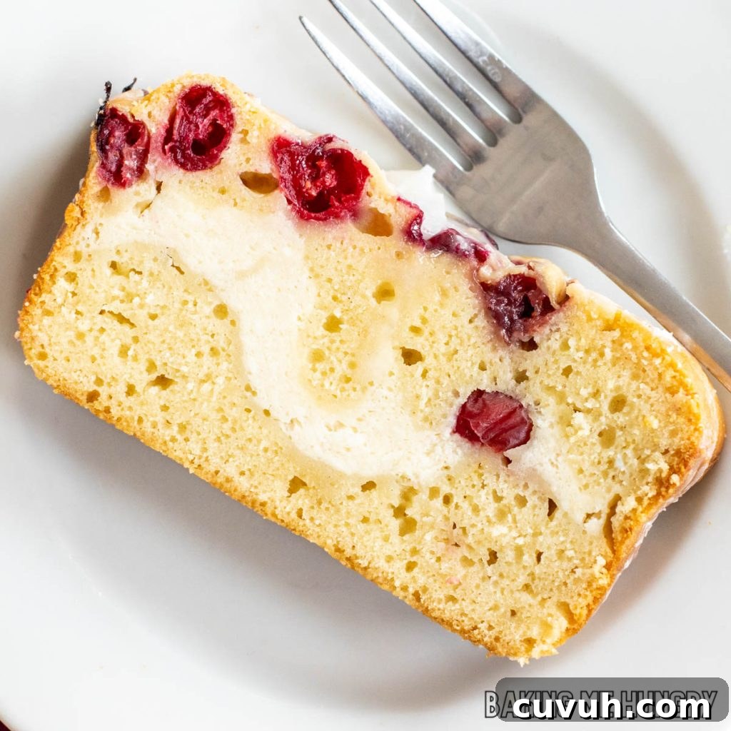 cranberry cream cheese bread recipe sliced and served on plate