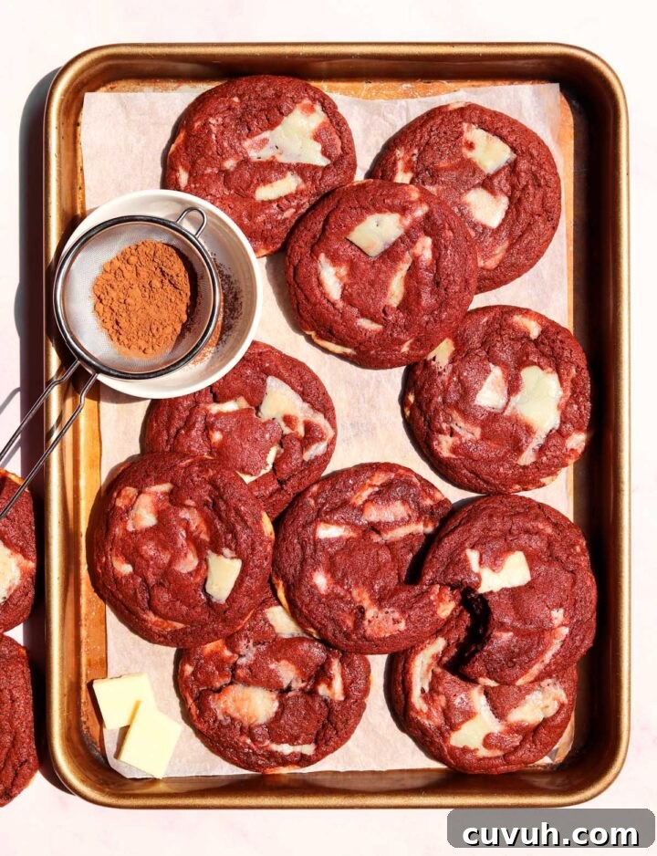 Decadent Red Velvet Cookies Recipe for Perfect Soft-Chewy Treats 2 red velvet cookies on baking sheet
