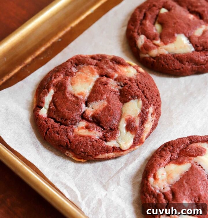 Decadent Red Velvet Cookies Recipe for Perfect Soft-Chewy Treats 10 red velvet cookies on parchment-lined baking sheet