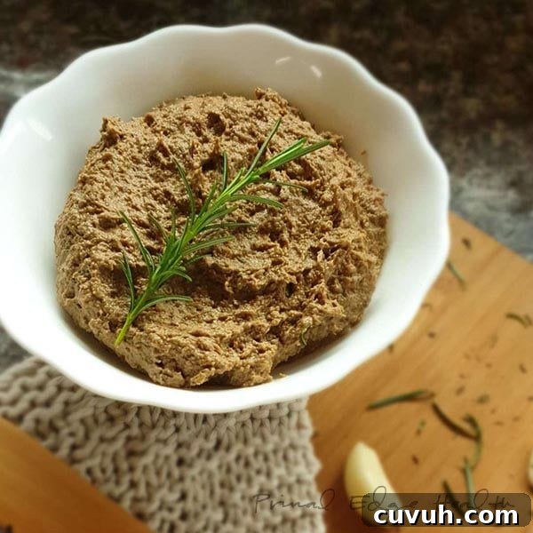 Liver Pâté Guide for Keto and Carnivore Diets: Recipes & Tips 3 A bowl of liver pate with a sprig of rosemary.