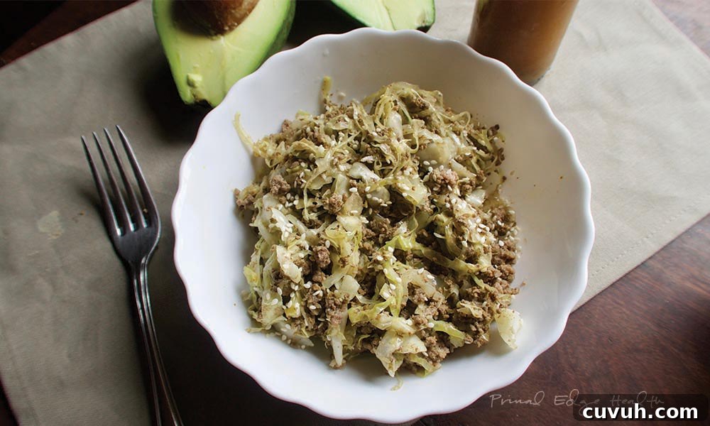 Liver Pâté Guide for Keto and Carnivore Diets: Recipes & Tips 7 A serving of cabbage noodles with beef in a white bowl on a wooden surface.