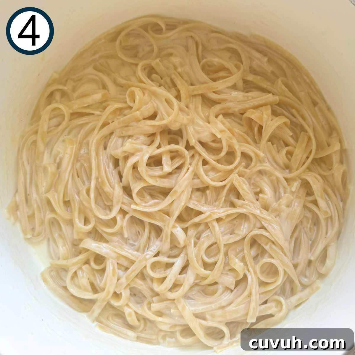 Creamy pasta alfredo in a pot.
