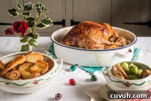 Turkey Leftover Pie Recipe: Zero-Waste Christmas Dinner Idea 3 White table cloth with enamel roasting pan with roast chicken and white bowls of parsnips and Brussels sprouts