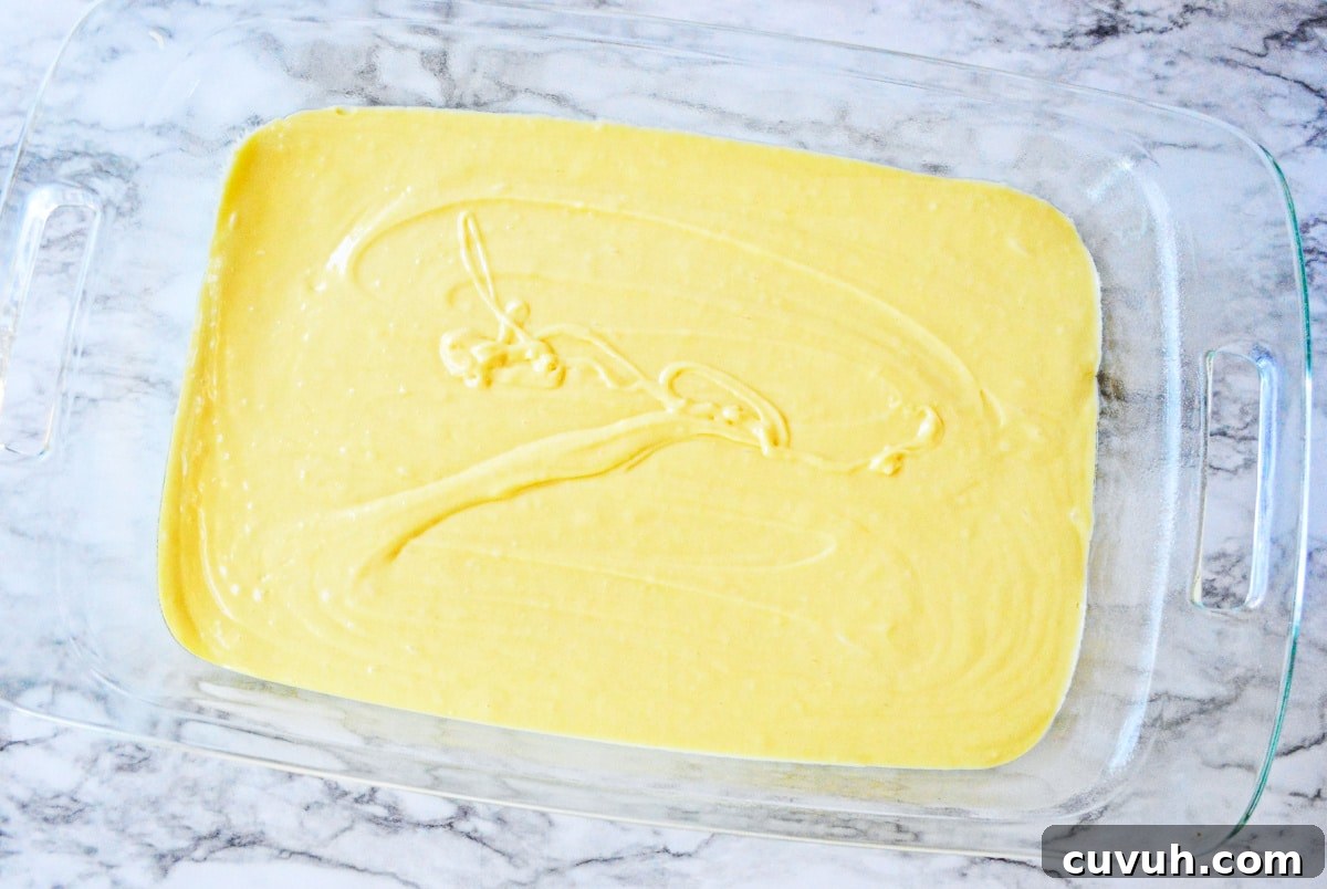 yellow cake batter in 9 by 13 glass pan