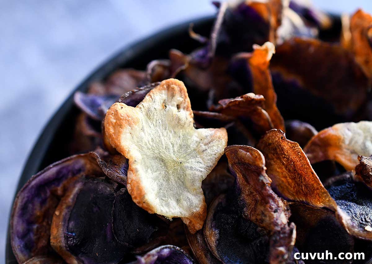 Cut out ghost mini potato chip on top of purple potato chips made int he air fryer.