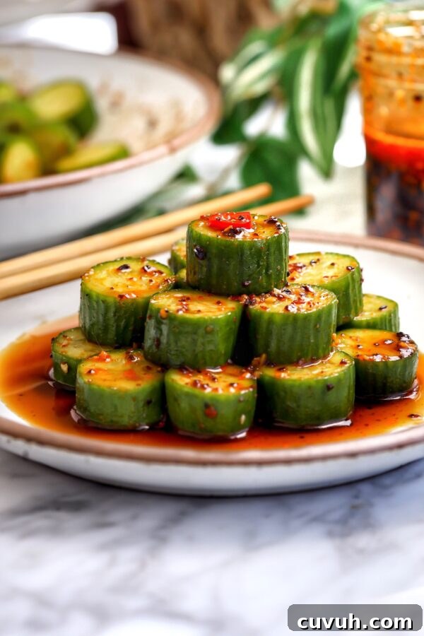Crab Rangoon Taquitos with Sweet Chili Honey Glaze 9 Marinated cucumber salad with soy, sesame oil, garlic, and chili, stacked and spooned with marinade