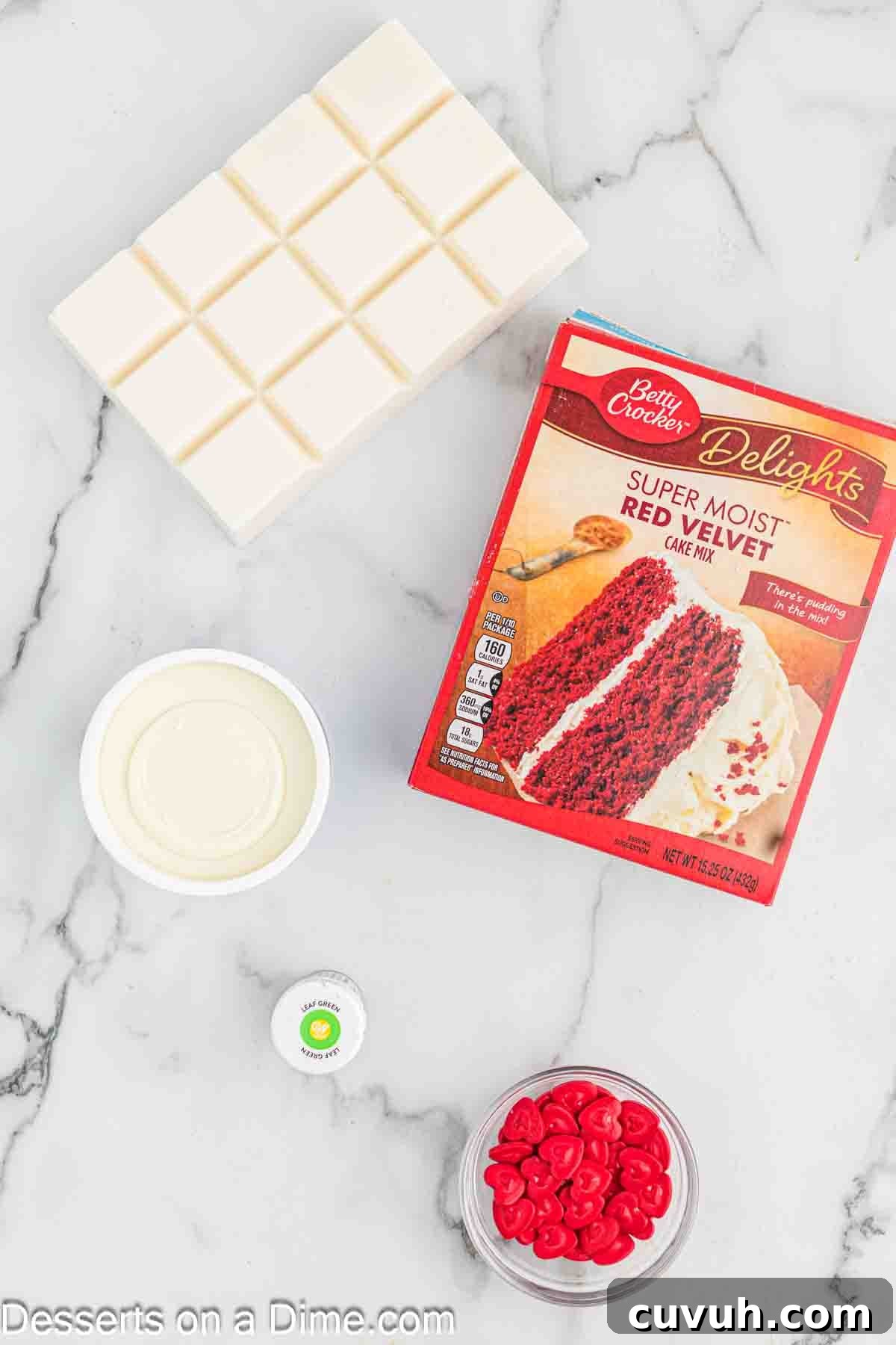 Ingredients for Grinch Cake Balls - cake mix, frosting, red heart sprinkles, food coloinrg. 