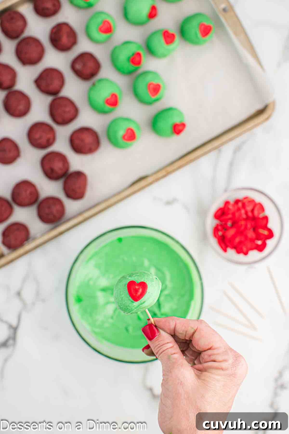 Heart sprinkle added to cake ball. 