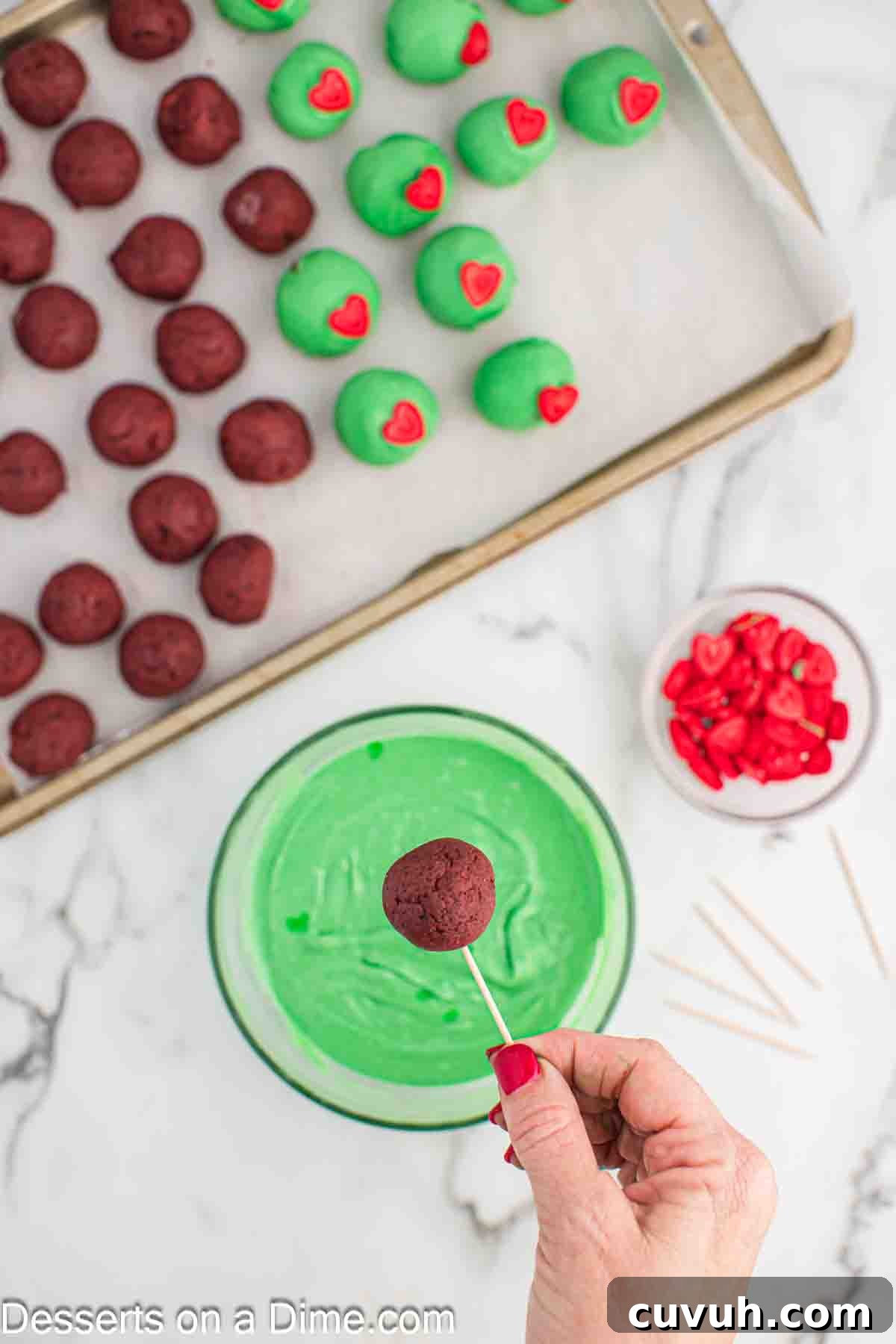 More cake balls being dipped. 