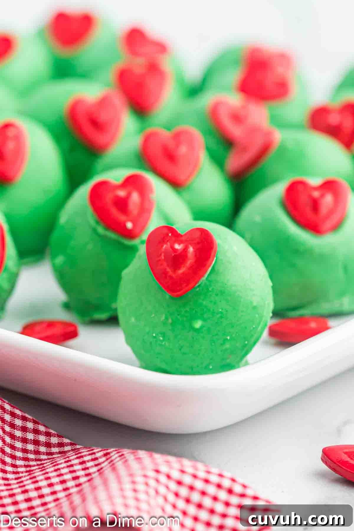 Grinch Cake Balls on a plate. 