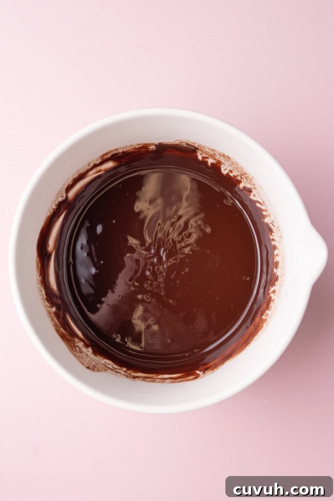 Melted chocolate in a large mixing bowl.