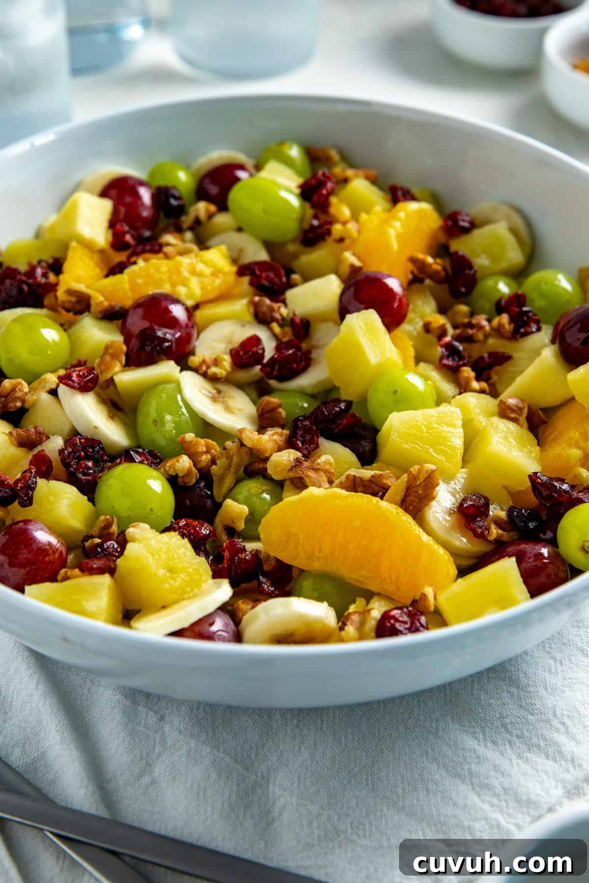 Fruit Salad in a white serving bowl.