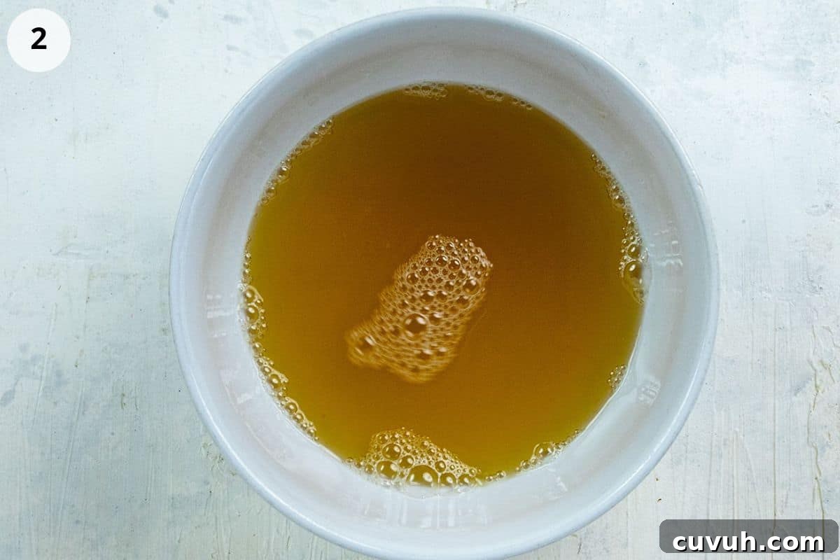 Honey lime dressing in a small bowl.