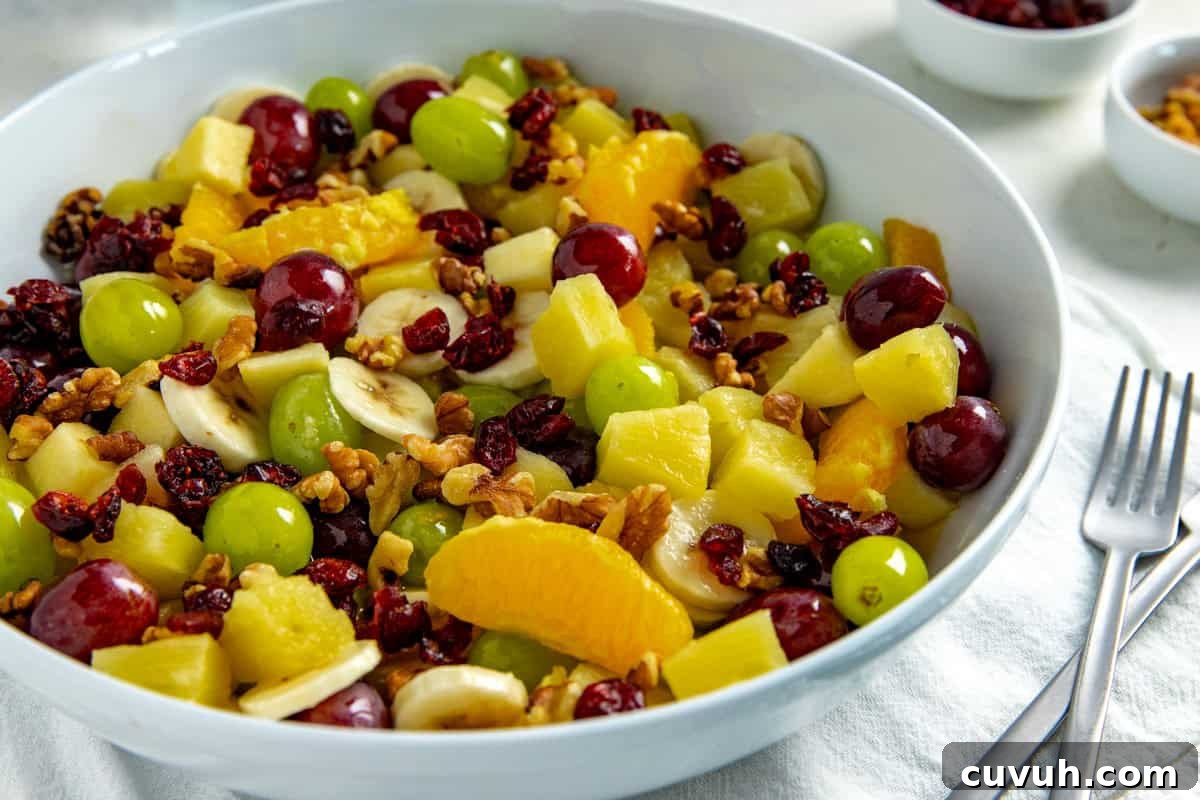 Fruit Salad in a white serving bowl.