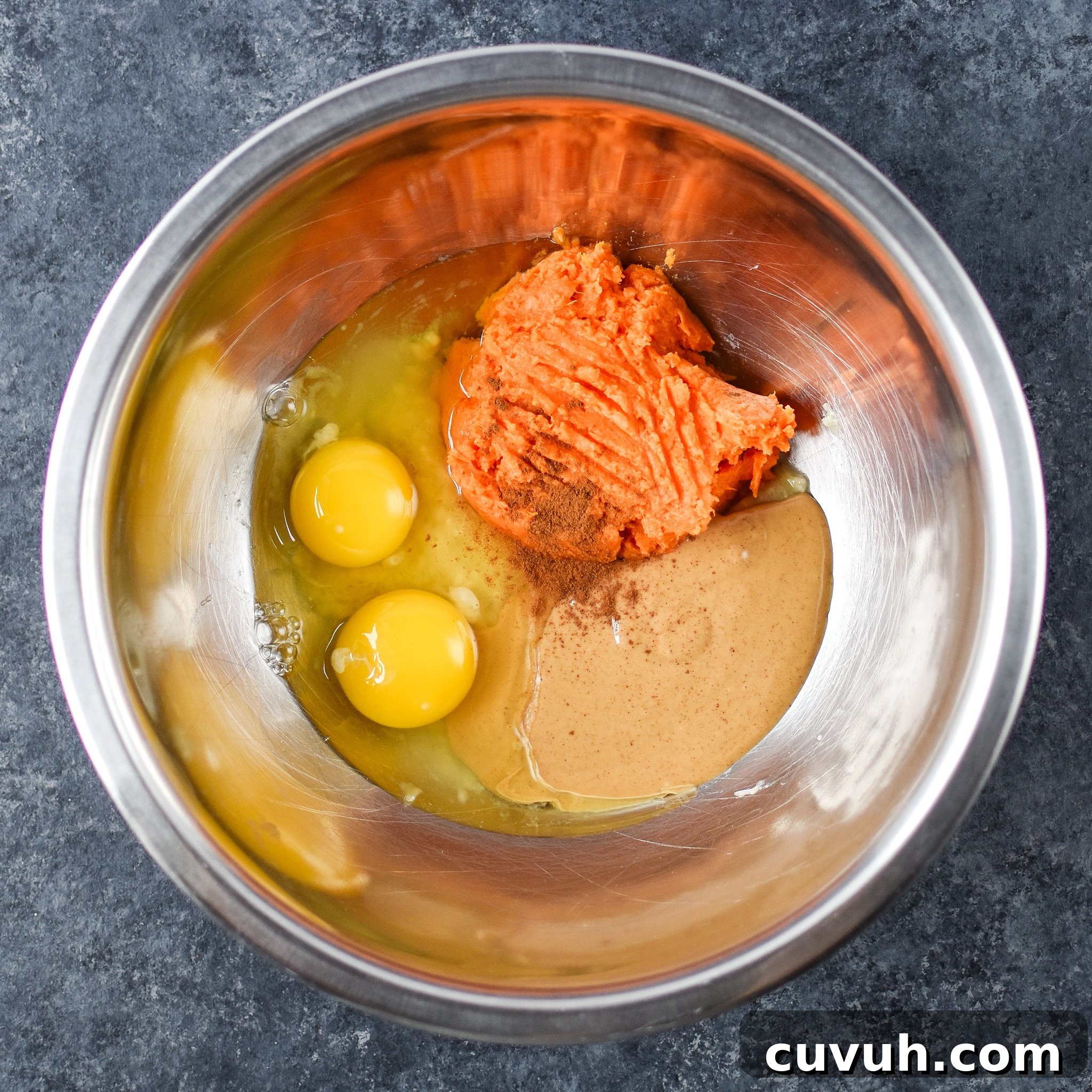 5-Ingredient Sweet Potato and Banana Pancakes Recipe 4 5-Ingredient Sweet Potato Banana Pancakes - Banana, sweet potato, nut butter, eggs and cinnamon are all you need to make these simple pancakes happen. Here are all the ingredients in a bowl ready to be mixed.
