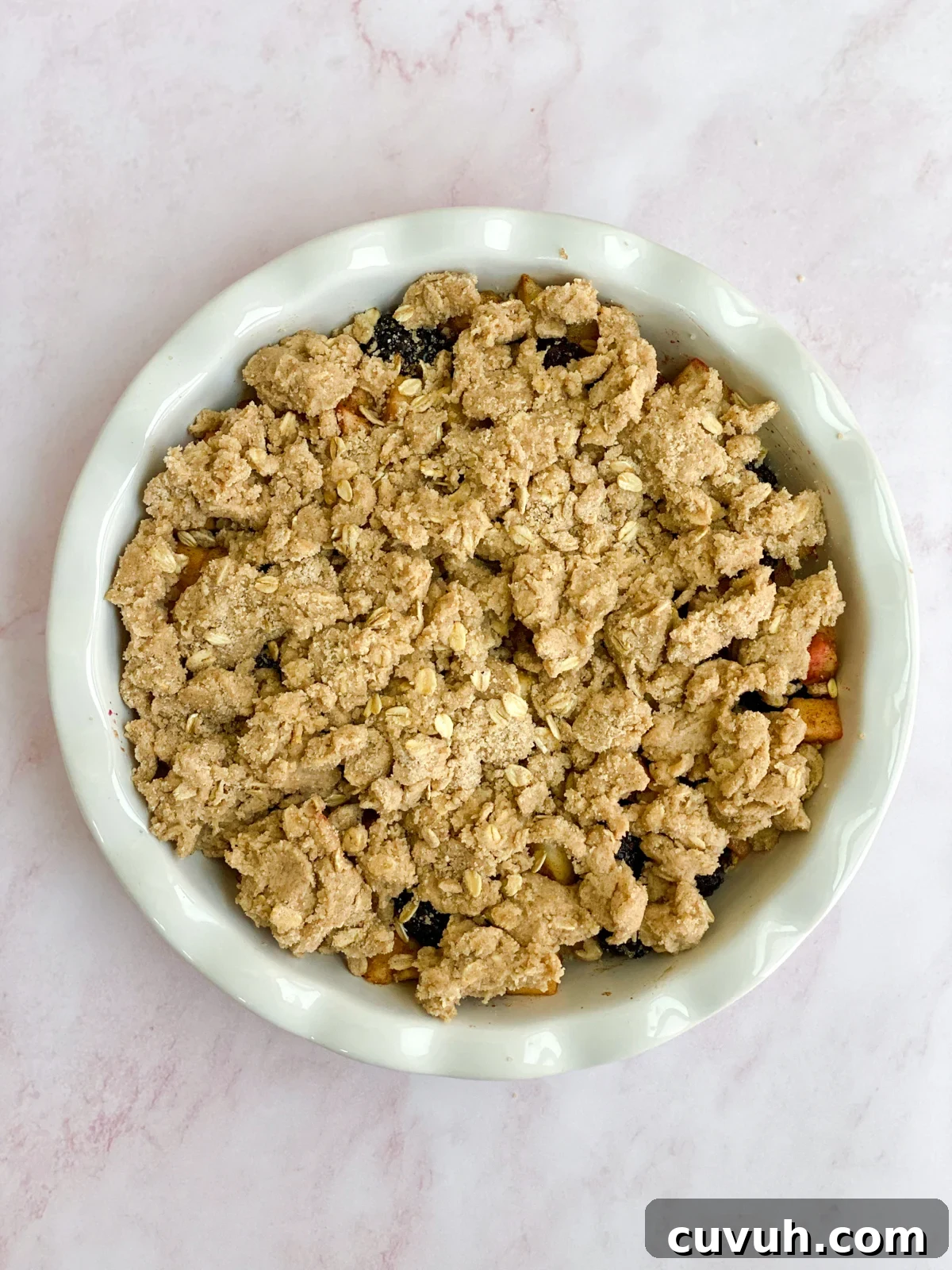 Blackberry Apple Crumble Recipe with Crisp Golden Topping 9 topping placed on the crumble.