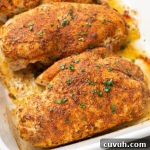 Juicy Oven-Baked Chicken Breast Recipe for Weeknight Dinners 8 a baking dish with four baked chicken breasts