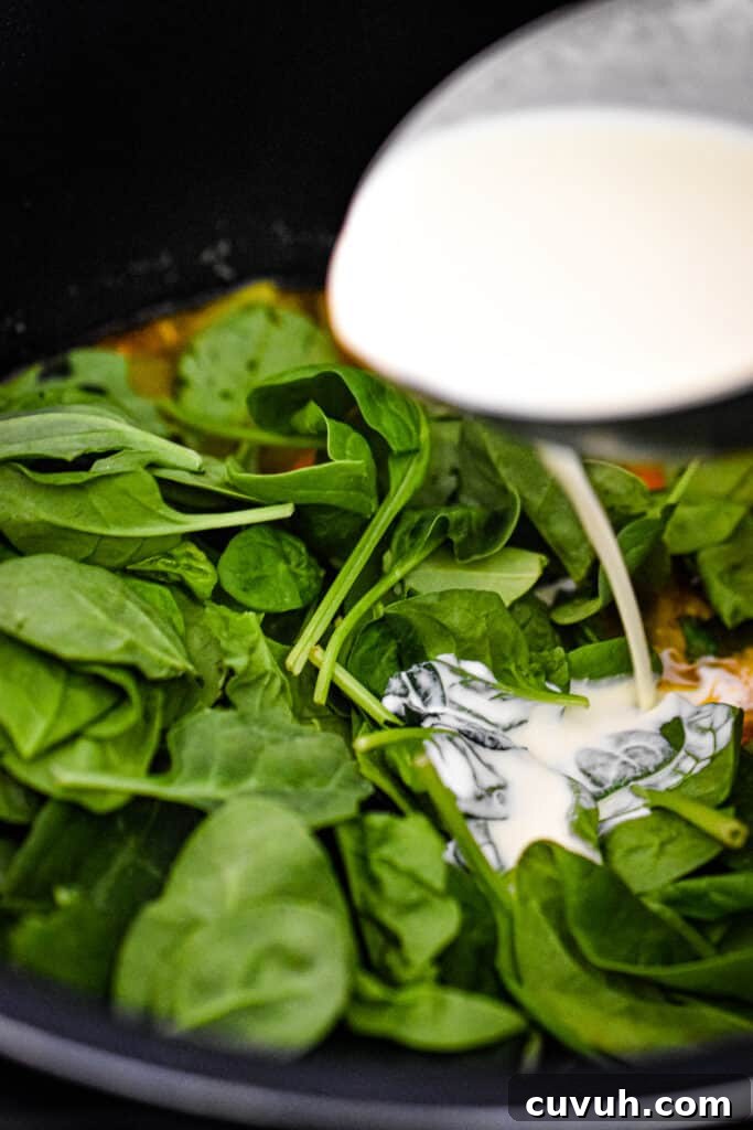 Instant Pot Zuppa Toscana: Sausage and Spinach Soup Recipe 9 The Instant Pot Zuppa Toscana is done cooking and the spinach and heavy cream are added to the soup