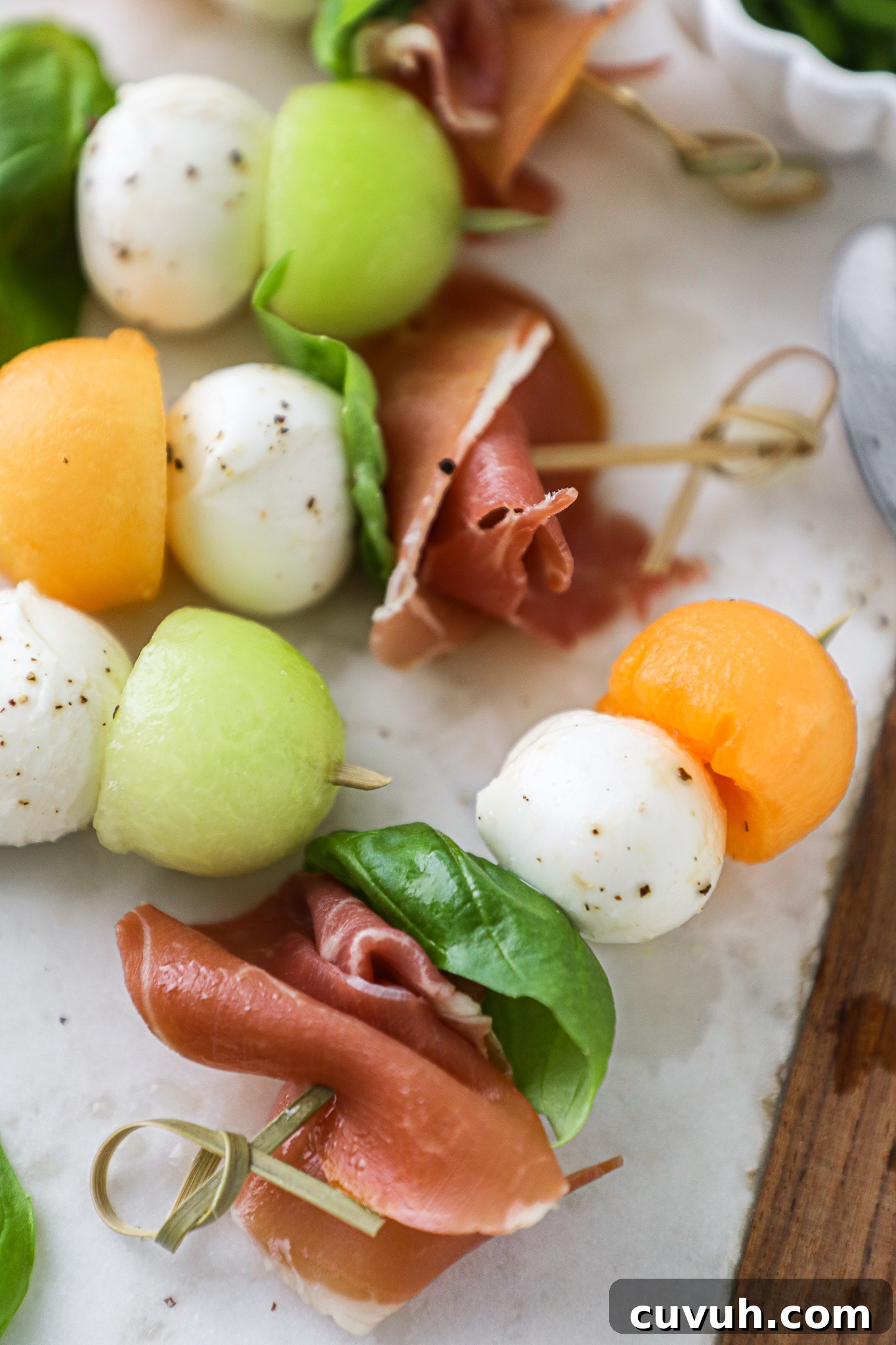 These melon and mozzarella skewers are the perfect appetizer to serve this summer! They're only 4 ingredients and are always a crowd favorite!