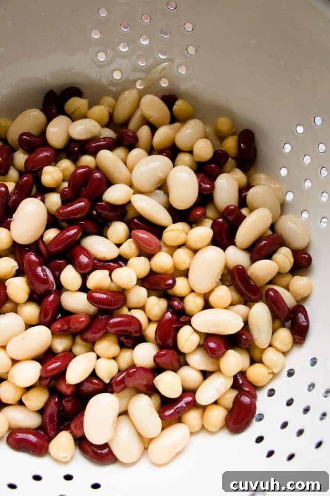 Beans for bean stew in a pan being washed.