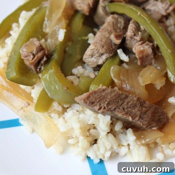 Slow cooker pepper steak that is melt in your mouth delicious. The best pepper steak recipe with tender and juicy steak, onion and peppers in every bite #slowcooker #peppersteak #easydinner slow cooker pepper steak without tomatoes