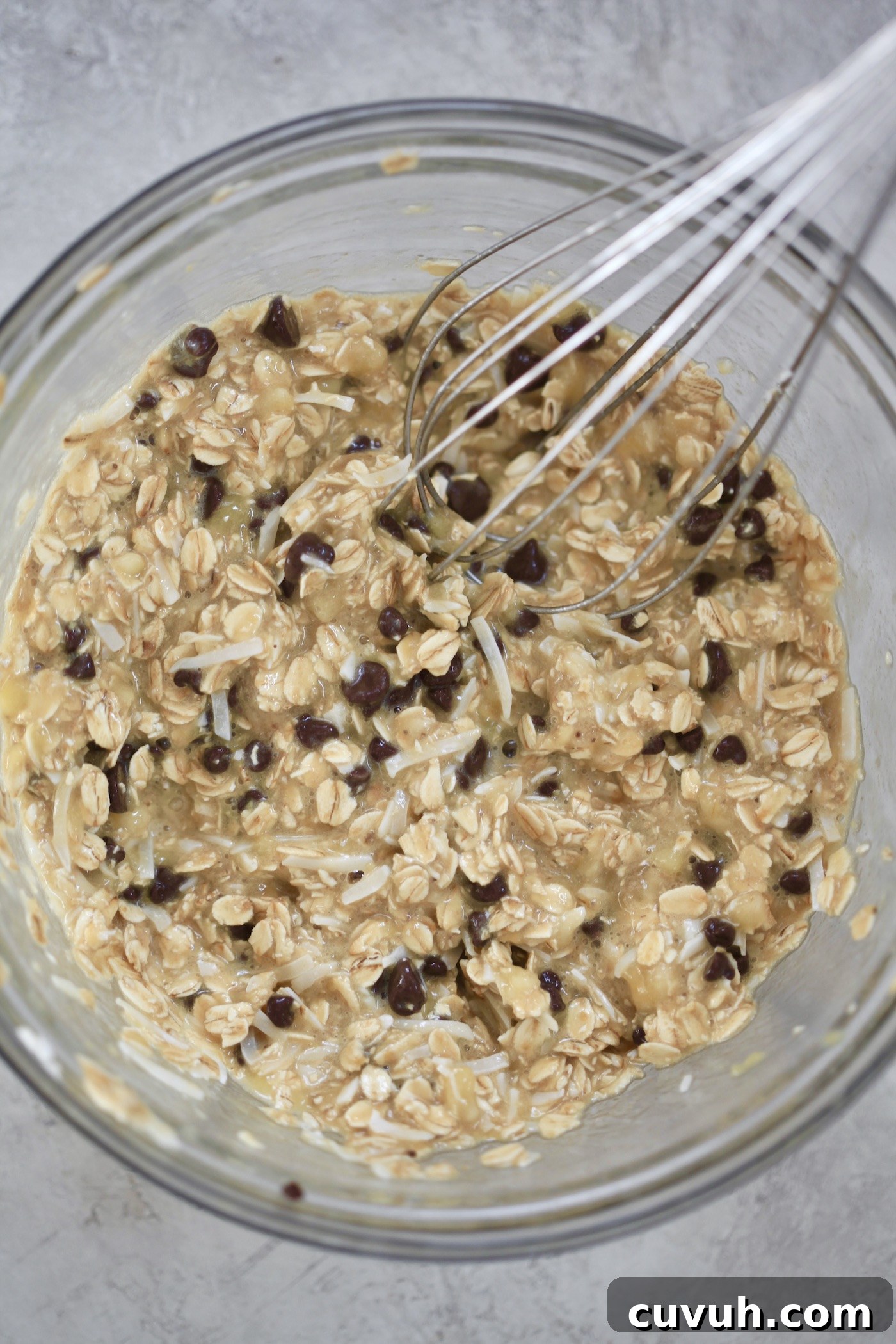 Banana Oatmeal Breakfast Cookies for Quick Morning Fuel 7 oats mixed with chocolate chip and whisk.