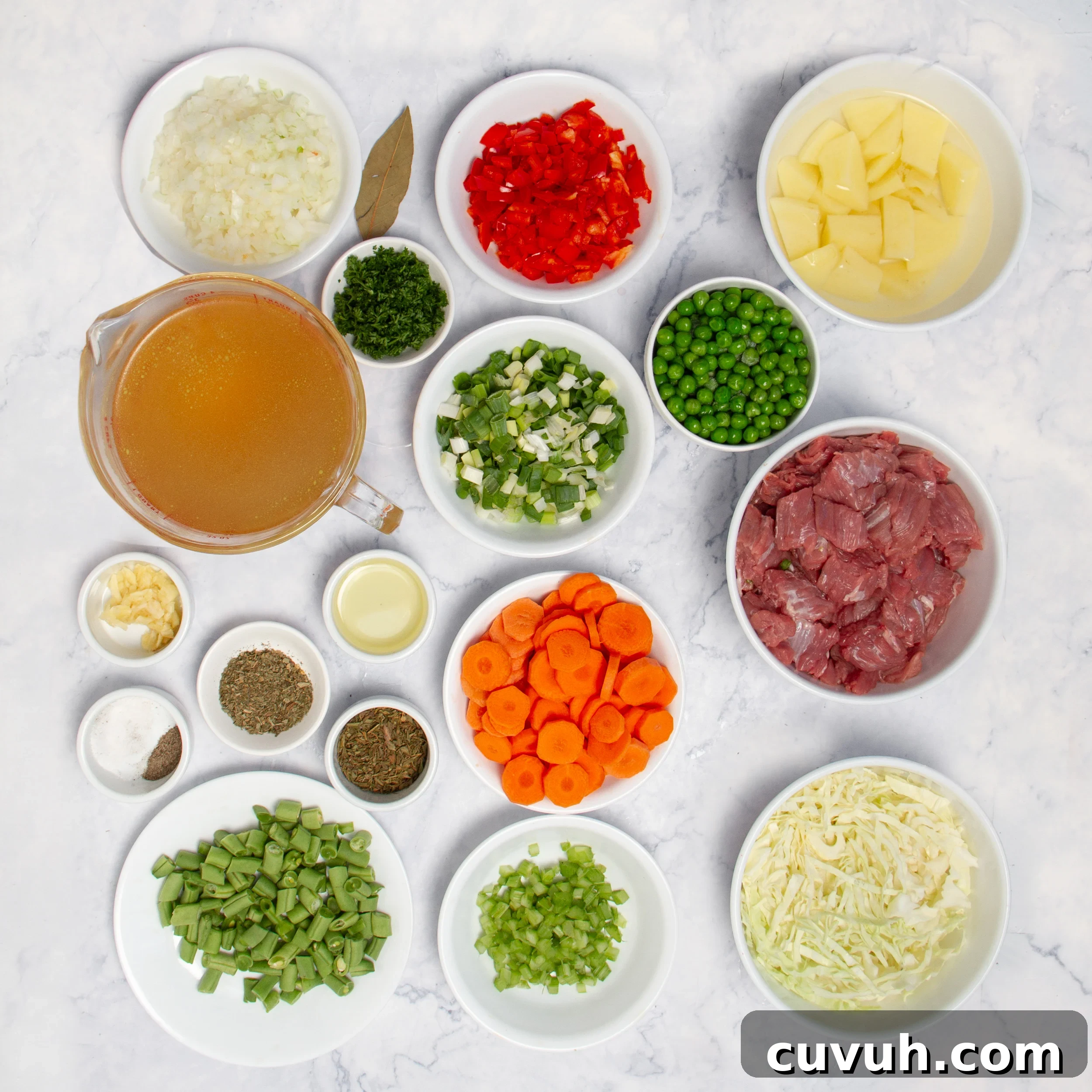Mulligan Stew Recipe: Hearty One-Pot Comfort Meal 3 Milligan Stew ingredients in separate dishes on a countertop.