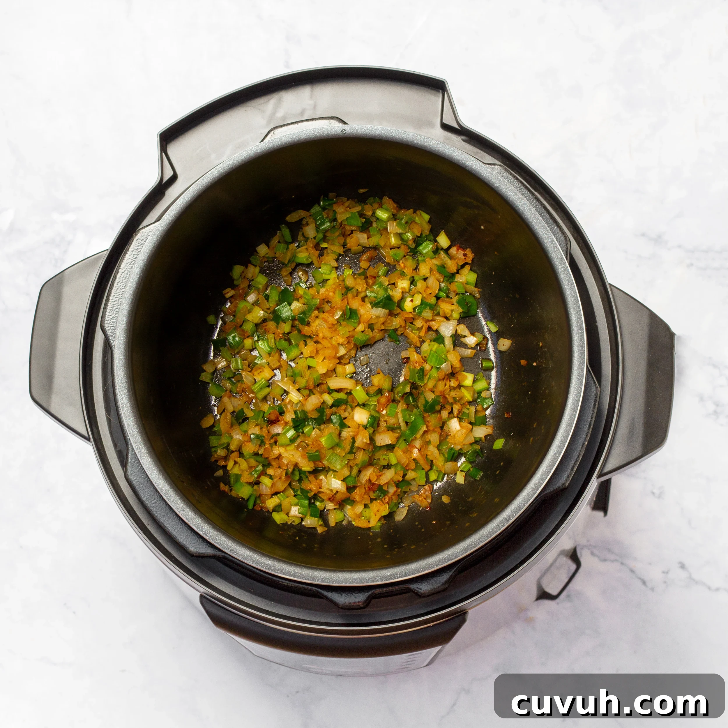 Mulligan Stew Recipe: Hearty One-Pot Comfort Meal 6 Aromatics sautéing in the soup pot.