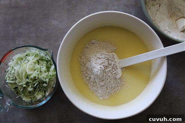 Adding flour mixture to batter of zucchini bread