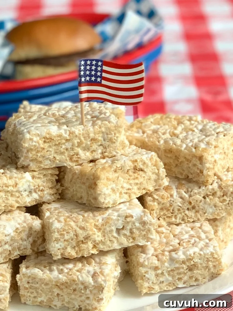 Patriotic 4th of July Desserts to Impress Your Guests 3 rice krispie squares cut and on a platter with 4th of July decorations