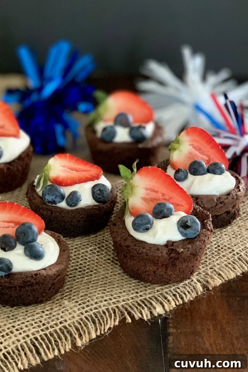 Patriotic 4th of July Desserts to Impress Your Guests 4 Brownie bites with cocowhip, blueberries, strawberries and 4th of July decorations