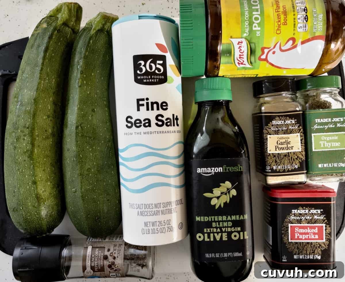 ingredients for air fryer zucchini spread out on cutting board