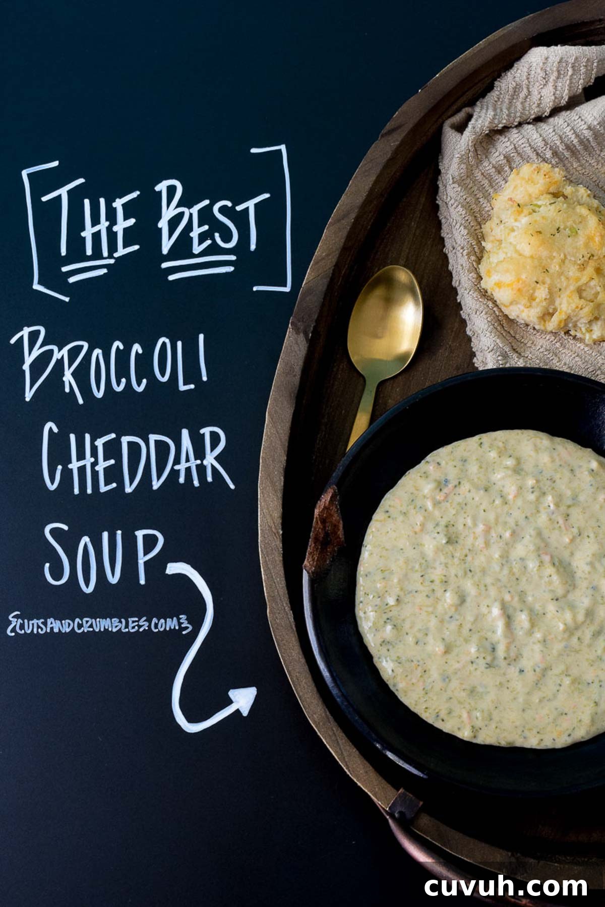 Broccoli Cheddar Soup served in a black bowl with title written on chalkboard