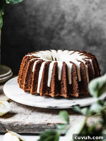 Applesauce bundt cake with vanilla glaze.