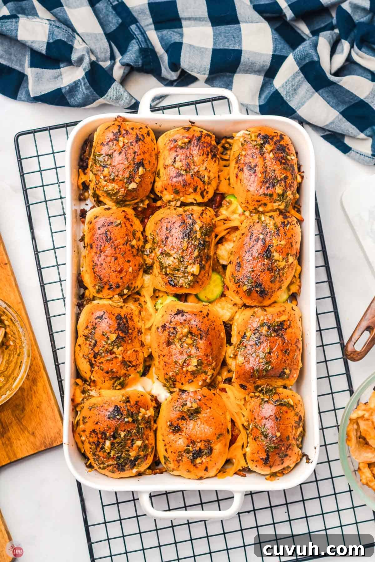 white dish of cooked cowboy sliders on a wire rack