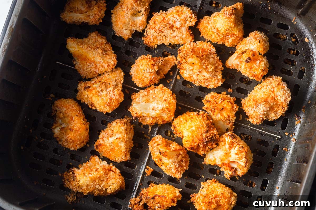 Crispy Air Fryer Buffalo Cauliflower Recipe 12 air fried buffalo cauliflower in the air fryer basket.