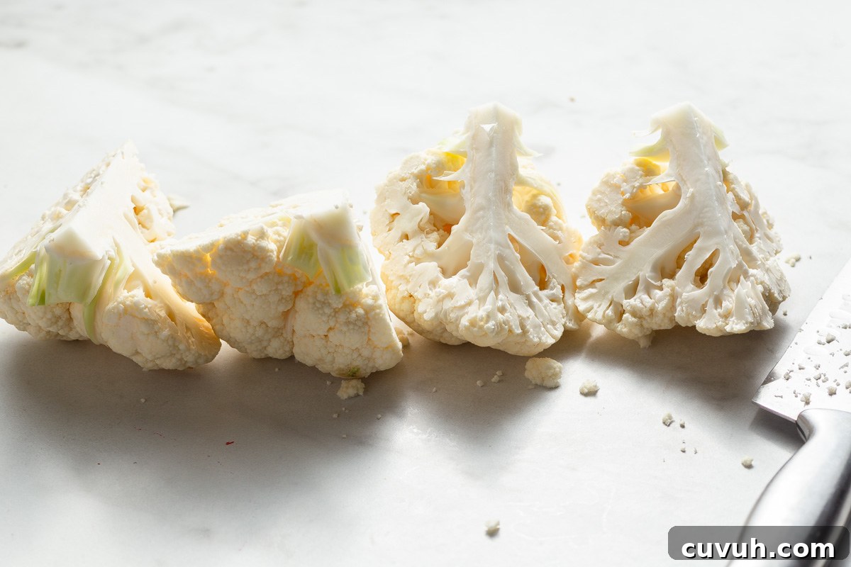 Crispy Air Fryer Buffalo Cauliflower Recipe 4 cutting the cauliflower into quarters.