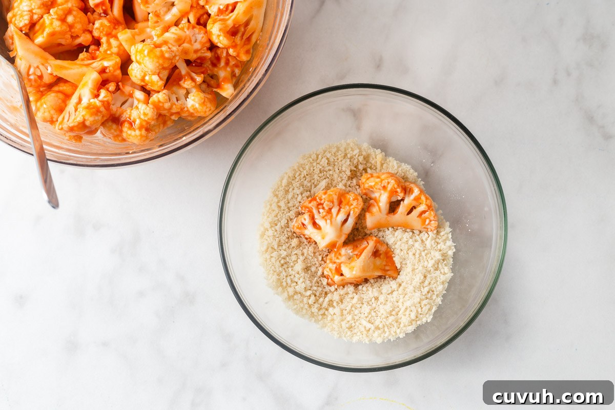 Crispy Air Fryer Buffalo Cauliflower Recipe 10 dipping the buffalo cauliflower in breadcrumbs.