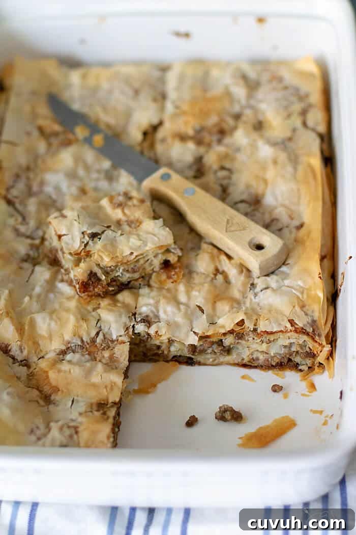 Layered Burek: Flaky Fillo Meat Pie Recipe 4 Savory meat filling between layers of crispy fillo pastry sheet