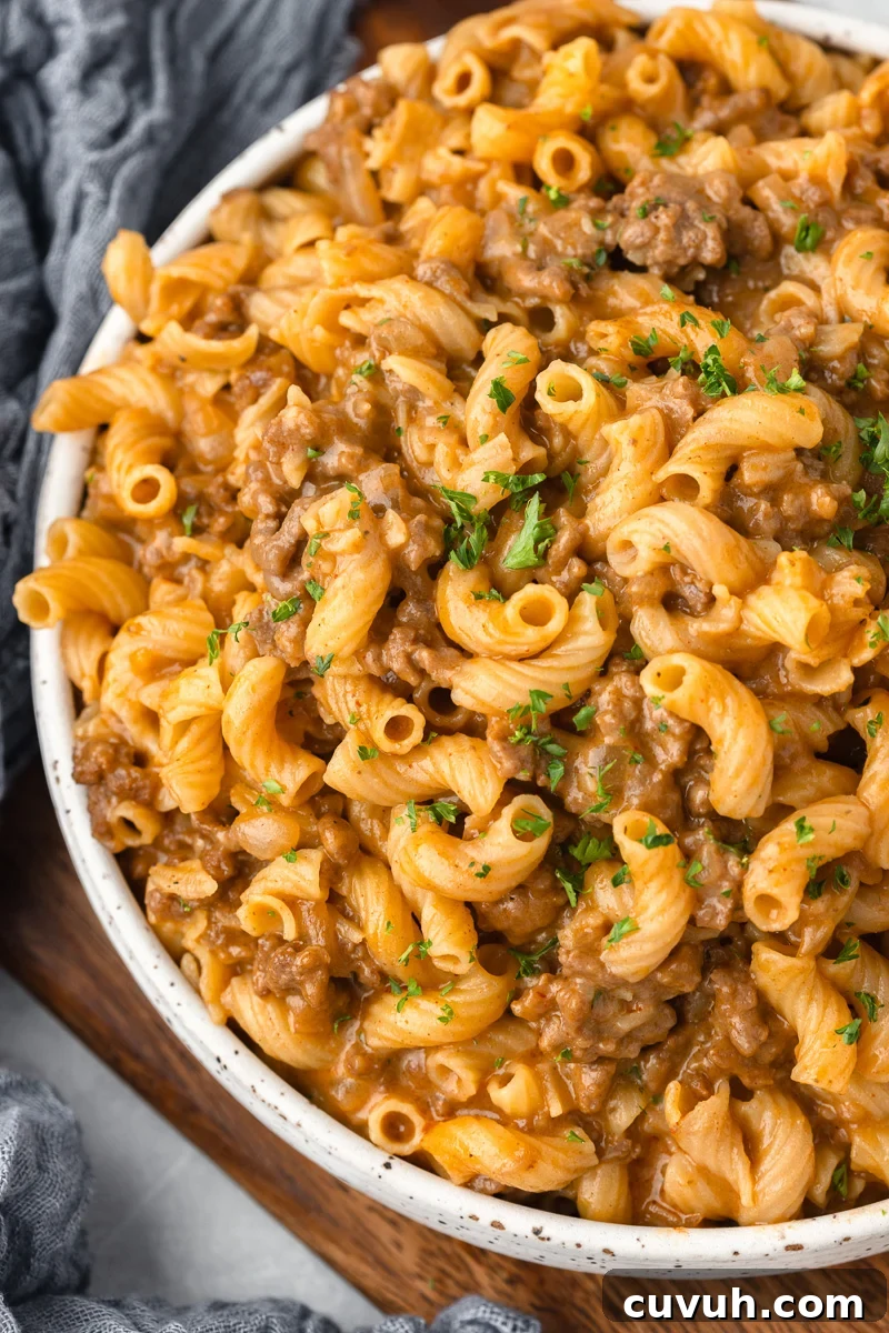 Cheeseburger pasta in a white bowl.